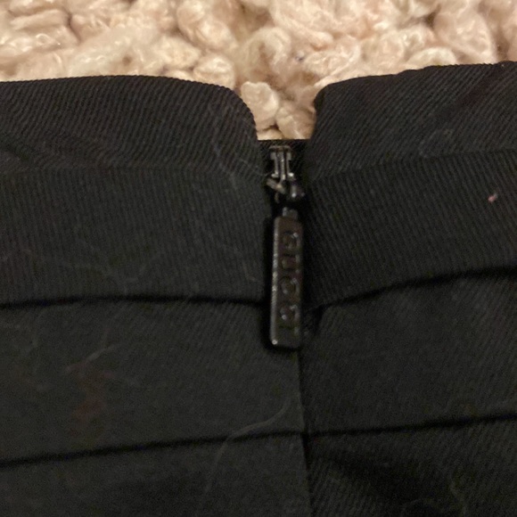 Black Gucci mini skirt with two silver GGs that rest on your back hips. With bag - Picture 5 of 10